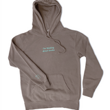 A grey/brown hoodie with the embroidered words "I'm thinking about books." across the chest and a small book on the right cuff in light blue.