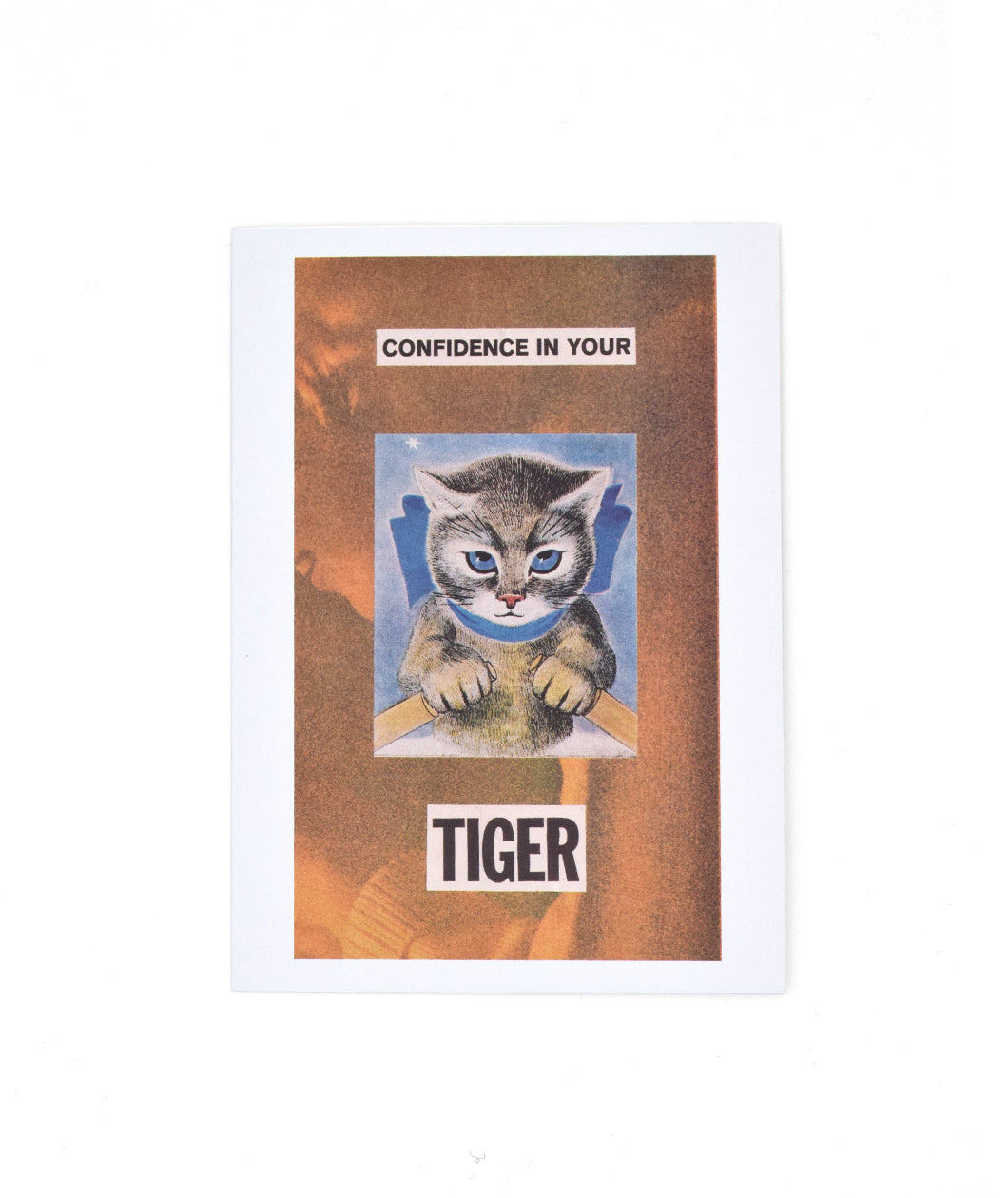 A white greeting card with a photo on the front of an orange monochrome image of a person. “Confidence in your Tiger” is in black sans serif font split on top and bottom of an image of a cartoon cat - from The Art Assignment