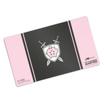 A pink rectangular playmat with curved corners. In the center, there is a black square. A pink line and black line are on either side. In the center of the square, there is a gray shield with a pink piggy bank with a quarter being inserted. Two gray swords are behind. “Close Quarters” is in the bottom left. “The Commander’s Quarters” in the bottom right with a signature above it - from Commander’s Quarters
