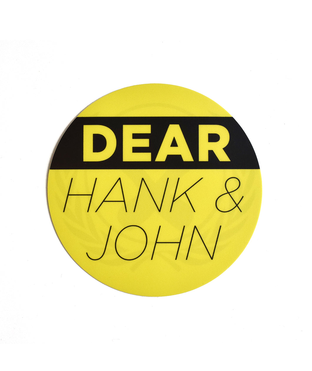 A yellow circle decal with "Dear John and Hank" written in big lettering.