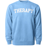 Light blue crewneck sweater with “Therapy” in white with a gray outline arched across the chest - from Don’t Blame Me