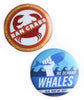 One red and white pin with a drawing of a crab with the words "ban crabs" striking through it. One blue and white pin with a drawing of a fist holding a whale and the words "We demand whales. Also, what are they?" - by Door Monster
