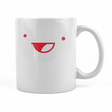 A white mug with a red, open mouthed smily face depicting the Drawfee logo. 