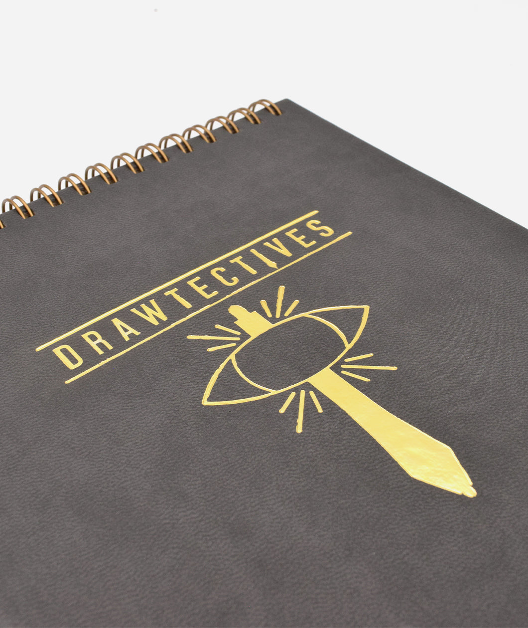 A close-up on a gold drawing of a sword and an eye below the word "Drawtectives"- by Drawfee