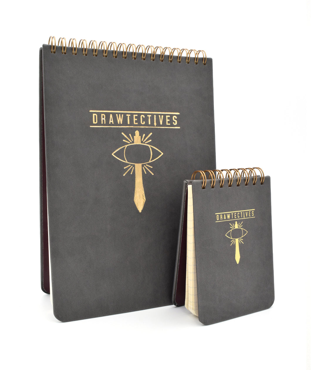 One large and one small black spiral notepad with gold writing and drawing - by Drawfee