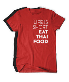 A bright red t-shirt with the words "Life Is Short Eat Thai Food" written down the right side. There is a black t-shirt behind. From Hot Thai Kitchen. 