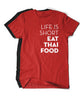 A bright red t-shirt with the words "Life Is Short Eat Thai Food" written down the right side. There is a black t-shirt behind. From Hot Thai Kitchen. 