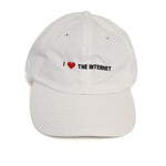 A white baseball cap with the phrase "I <3 The Internet" on the front in black and red - by Charles Trippy
