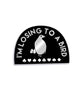 Black half circle pin with a thin silver border. “I’m losing to a bird” is arched in silver sans serif font. In the center is a silhouette drawing of a silver bird with a black eye holding four cards standing above card suits - from Lindsay Ellis
