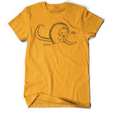 Yellow shirt with cartoon, black line drawing of porcupine eating a banana all with yellow fill. "Kemosabe” is written in black sans serif font in bottom left of porcupine. "Coendou prehensilis” is below in cursive black font.” On right, black line leads from mouth with “nom nom” in black sans serif font - from Animal wonders