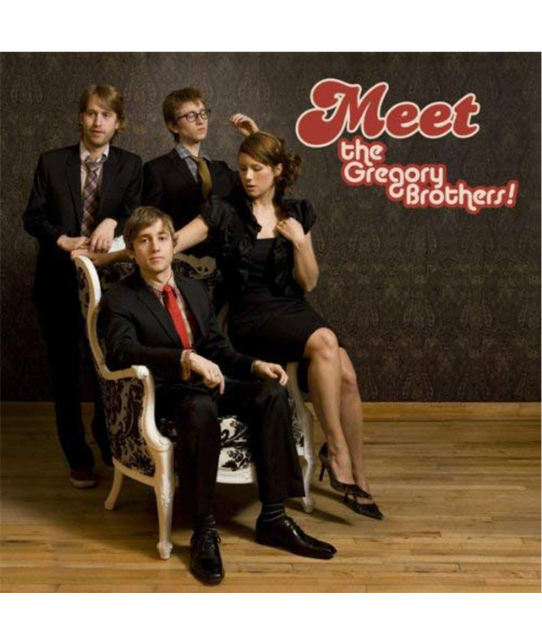 An album cover featuring four people posed in suits and a dress. On the cover it reads 