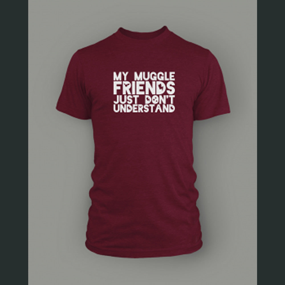 A dark red shirt with “My Muggle Friends Just Don’t Understand” in white sans serif font. Dark red silhouettes of lightning bolts, snitch, stars, and Deathly Hallows logo are in negative space of some letters - from Lauren Fairweather