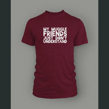 A dark red shirt with “My Muggle Friends Just Don’t Understand” in white sans serif font. Dark red silhouettes of lightning bolts, snitch, stars, and Deathly Hallows logo are in negative space of some letters - from Lauren Fairweather