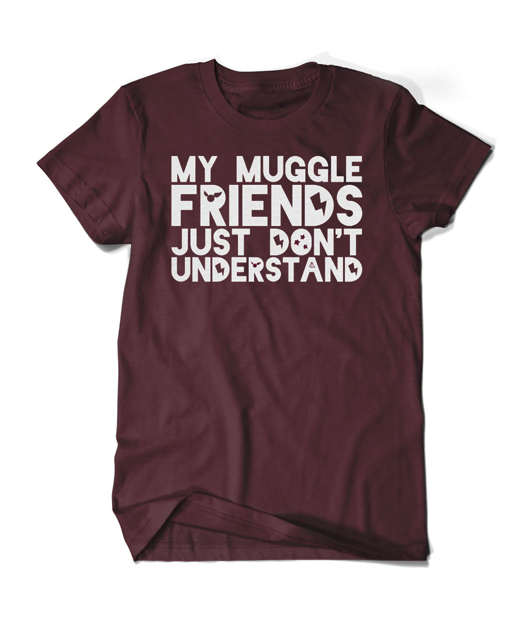 A dark red shirt with “My Muggle Friends Just Don’t Understand” in white sans serif font. Dark red silhouettes of lightning bolts, snitch, stars, and Deathly Hallows logo are in negative space of some letters - from Lauren Fairweather