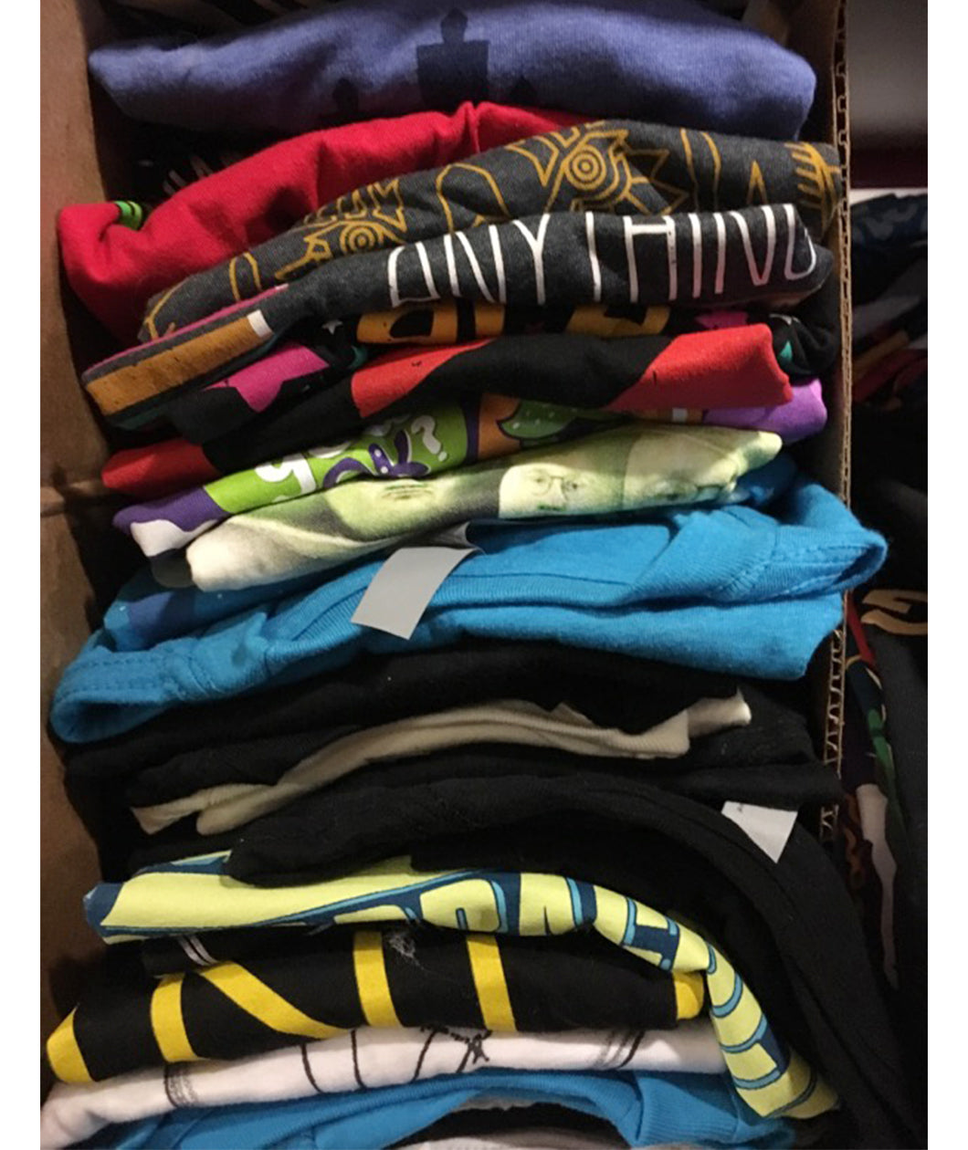 Stack of various styles of mystery shirts - from DFTBA Records