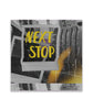 An out of focus square picture of a polaroid with yellow words "Next Stop". 