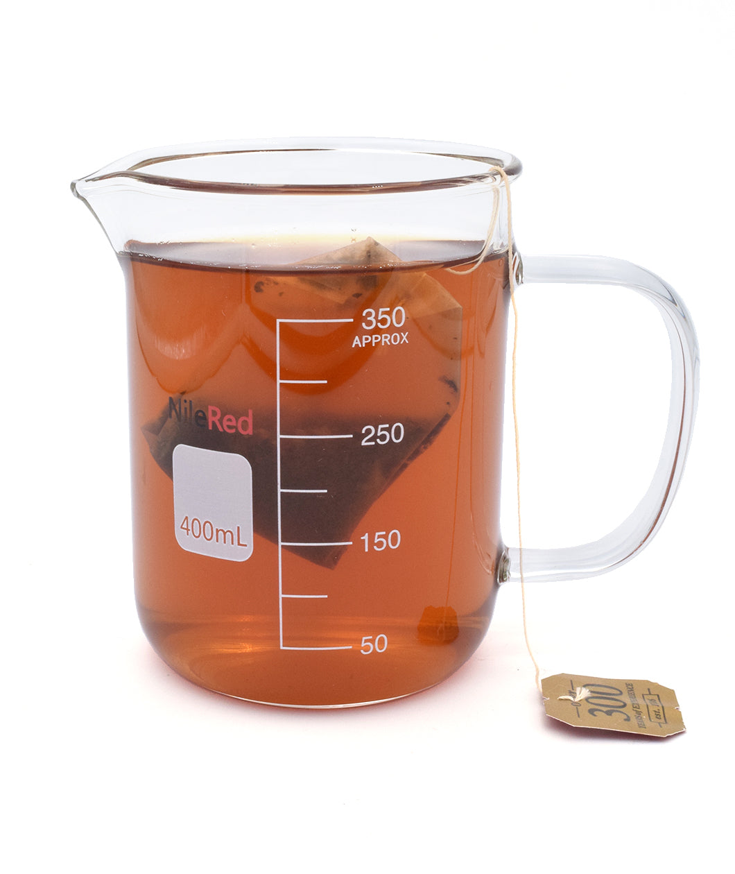 A glass beaker with a mug handle full of brown tea and a tea bag. On the side of the mug is the NileRed logo and a square that says 400mL and shows a scale of 350mL.