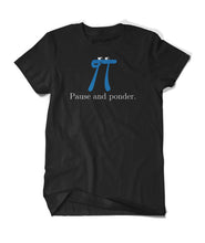 A black t-shirt with a blue pi with a small black smile and two white oval eyes with black irises on the top of the pi drawing with “Pause and ponder.” written underneath in a white serift font in the center of the shirt - from 3Blue1Brown.