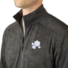 A heather gray zip up jacket with four white hexagons in varying sizes are on the top left of the jacket - from CGP Grey.