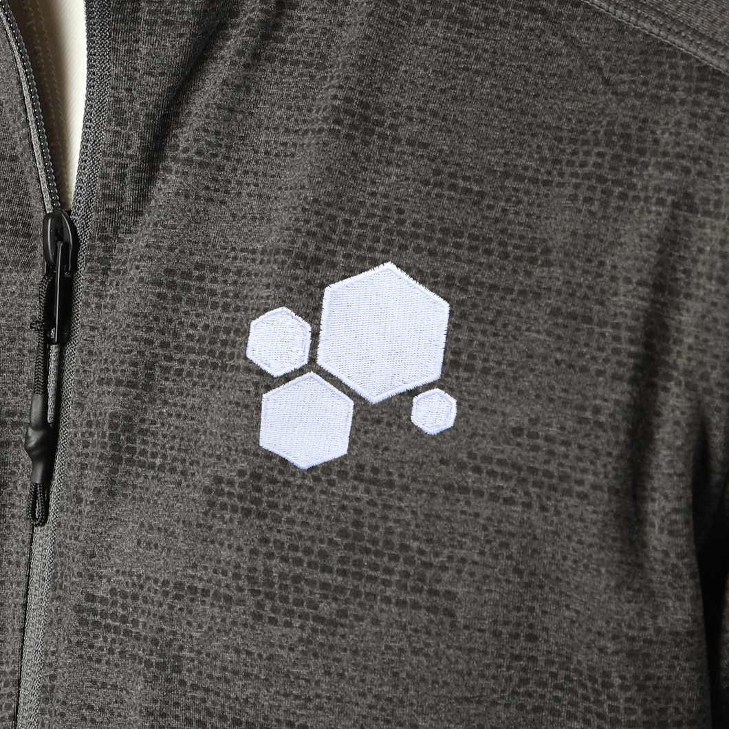 Four white hexagons stitched to the top left part of the jacket in varying sizes - from CGP Grey.