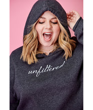 A woman modeling a dark gray crop top hoodie with “unfiltered” in white cursive font across the chest - from Sierra Schultzzie