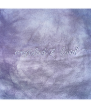 A close up of the lavender tie-dye crop top from Sierra Schultzzie, showing the embroidered words "confident & kind".