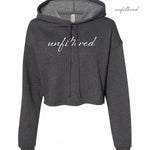 A dark gray crop top hoodie with “unfiltered” in white cursive font across the chest - from Sierra Schultzzie