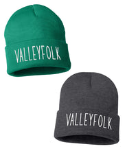 A green and gray beanie with “Valleyfolk” in white sans serif font across the front - from the Valleyfolk
